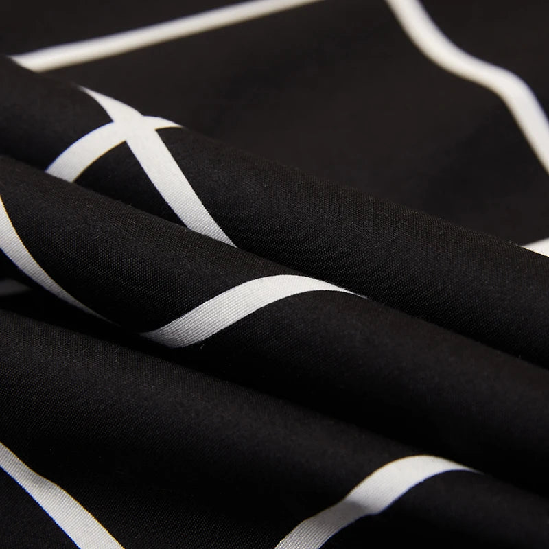 Close-up of black fabric with white stripes