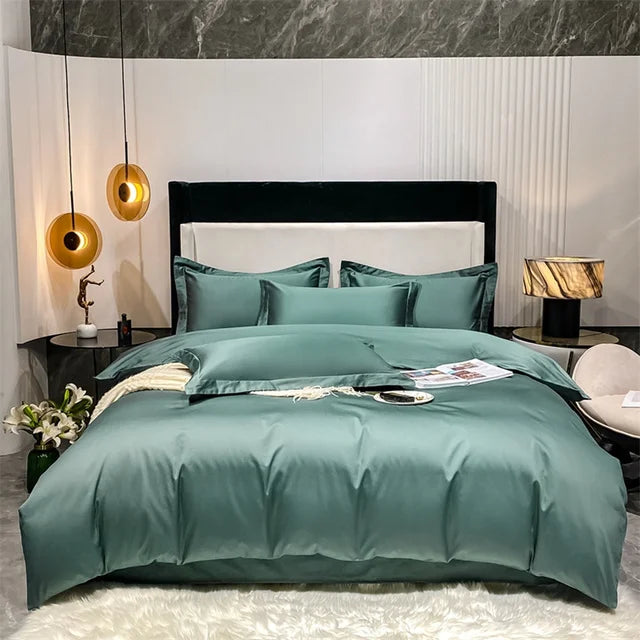 Teal bedding set on a bed in a modern bedroom with marble wall and decorative lamps.