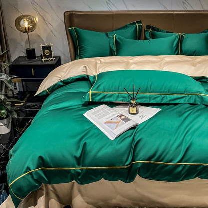 Green and beige bedding set on a bed with decorative items.